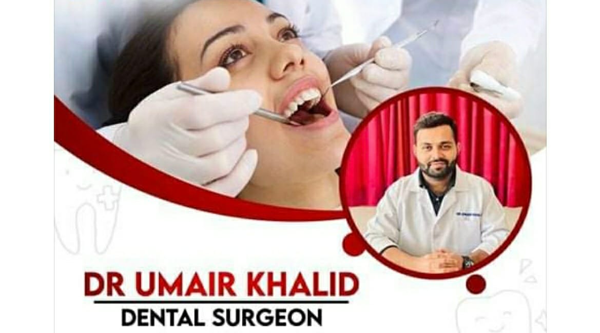 Dr. Umair Khalid performing a dental procedure